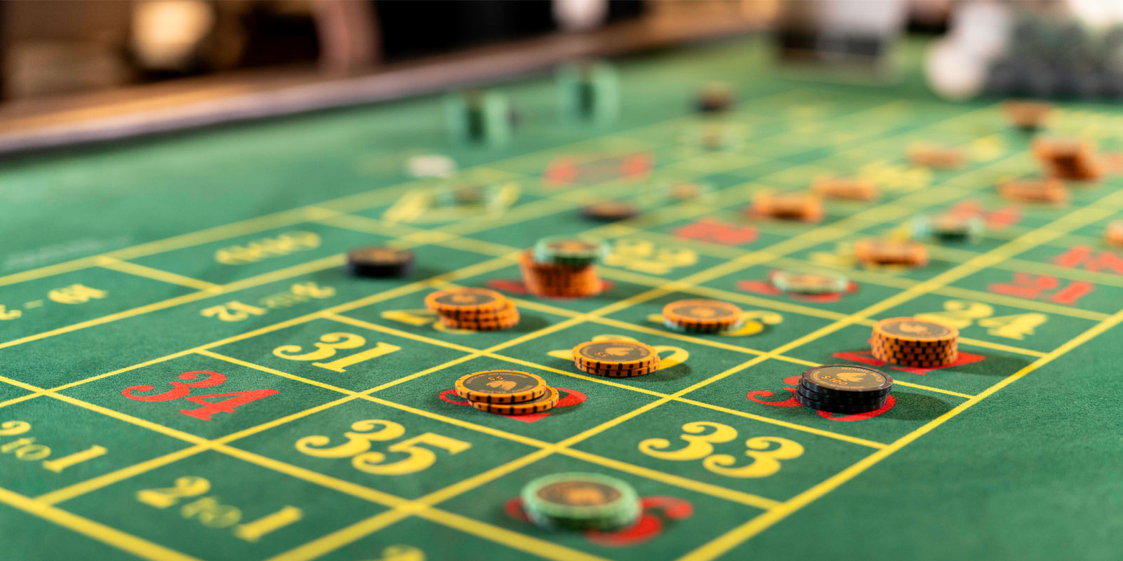 Casino table game on green felt table.